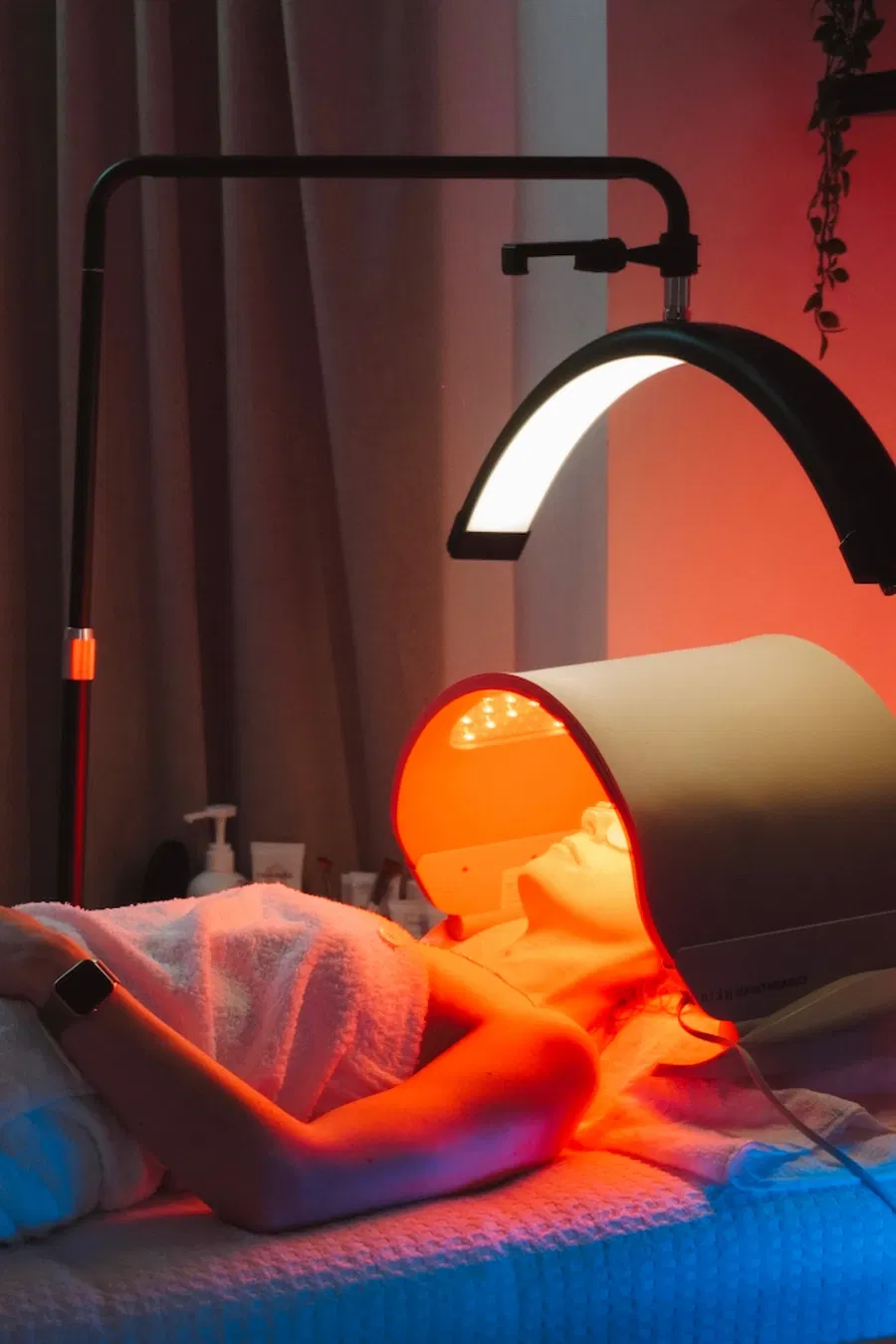 Client receiving Dermalux LED light therapy treatment at SLA Medical Clinic for skin rejuvenation